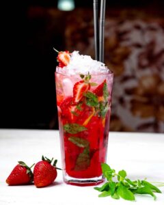 A strawberry twist on the classic Mojito, this Strawberry Mint Mojito 